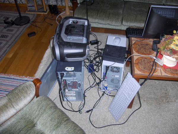 Two computers on living room floor