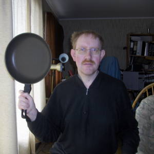 Man with frying pan